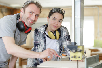 Wall Mural - happy man and woman in wood workshop