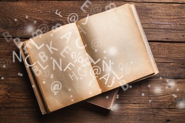 Wall Mural - vintage open book on old wooden table