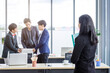 © Thinapob - Successful company,executive Young Asian businesswoman with hold file folder look at with happy workers Group of asian business people with diverse genders (LGBT)  in the meeting room at office