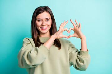 Canvas Print - Photo portrait of positive woman making heart with fingers isolated on vivid cyan colored background