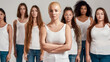 Portrait of beautiful young caucasian woman with shaved head in white shirt posing with arms crossed. Group of diverse women standing isolated over grey background