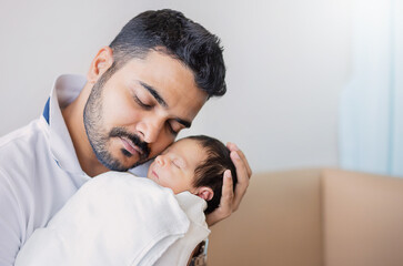 Closeup portrait of young asian Indian father holding his newborn baby with copy space. Healthcare and medical daycare nursery love lifestyle together single dad father’s day holiday concept