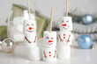 © New Africa - Funny snowmen made of marshmallows on white table