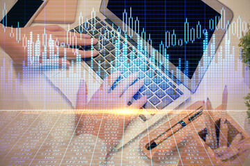 Double exposure of woman hands typing on computer and forex chart hologram drawing. Stock market analysis concept.