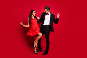 Aufkleber - Full size photo of optimistic couple dance wear vivid dress black suit isolated on red color background