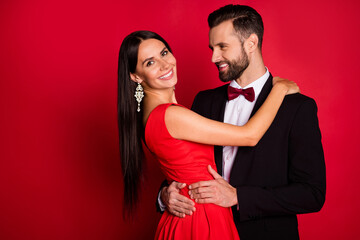 Canvas Print - Photo of nice couple dance hug wear suit dress isolated on red color background