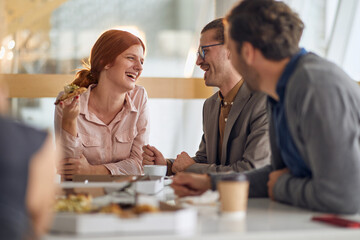 Wall Mural - Employees eating pizza together at lunch break at company canteen. People, job, company, business concept.