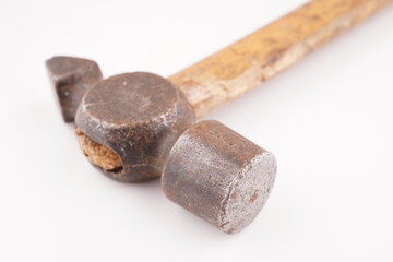 old hammer with wooden handle on white background