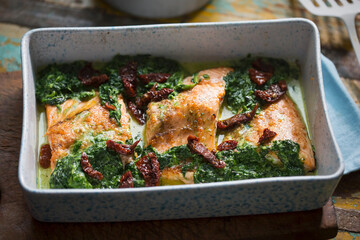 Wall Mural - Baked salmon with spinach and sun dried tomatoes 