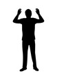 Silhouette of man surrenders with raised arms