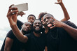 © Victor Torres/ADDICTIVE STOCK - Group of black race friends taking a selfie