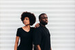 © Victor Torres/ADDICTIVE STOCK - Black cool couple posing over white background looking at camera