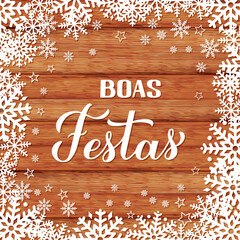 Wall Mural - Boas Festas calligraphy on wood background with snowflakes. Happy Holidays hand lettering in Portuguese. Christmas typography poster. Vector template for greeting card, banner, flyer, etc