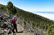 man hiking and photographing volcanic nature on canary islands