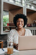 © Stereo Shot/Stocksy - Portrait of a successful black girl working with laptop