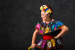 © Sollina Images/Blend Images - Hispanic woman dancing in Chiapas Folkloric dress