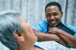 © FS Productions/Blend Images - Nurse talking to patient in hospital bed