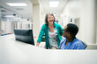 © FS Productions/Blend Images - Doctor and nurse laughing near computer