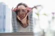 © JGI/Jamie Grill/Blend Images - Woman peering in through window