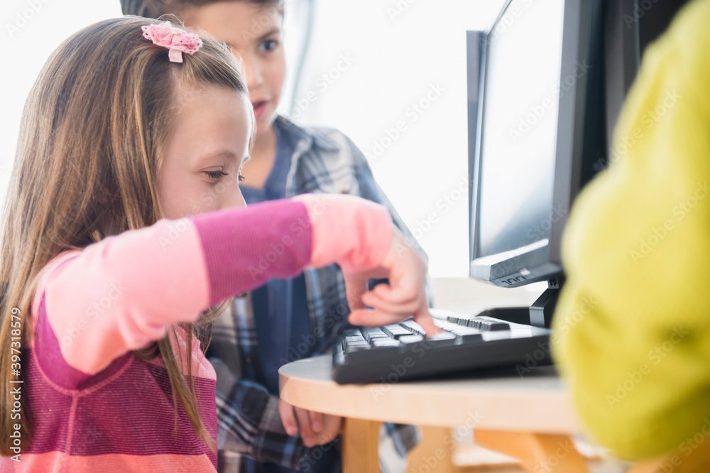 Children using computers in classroom Stock Photo | Adobe Stock