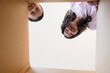 © JGI/Jamie Grill/Blend Images - Low angle view of Asian brother and sister opening box