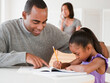© JGI/Jamie Grill/Blend Images - African American father helping daughter with homework