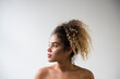 © JGI/Jamie Grill/Blend Images - Mixed Race woman with bare shoulders looking away