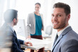 © JGI/Jamie Grill/Blend Images - Portrait of smiling businessman in office