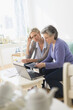 © Tetra Images/Tetra Images - Two mature women paying bills via internet