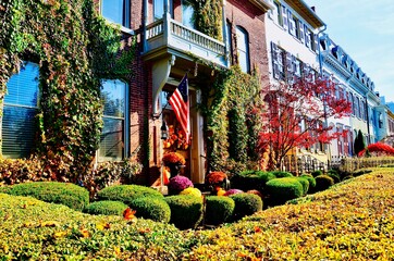 Cityscape of Geneva, New York. Historic row houses in downtown. Well maintained buildings, colorful paintings, beautiful gardens. A charming small town in America, has been on Playful City USA list.