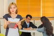 © shine - In the library - Asian Businesswoman with books working in library.
