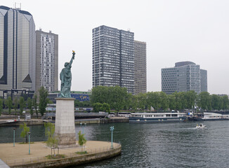  The swan island became a haven for a smaller Statue of Liberty. The copper lady, 11.5 meters high, peers at the distant shores of the American continent