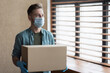 © kite_rin - Delivery man employee wearing face mask and gloves holding cardboard box in office. Service, business, lockdown, quarantine, pandemic, coronavirus covid-19, shipping, post concept
