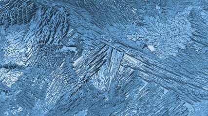 Ice crystals close up on a window glass. Mystical fabulous abstract pattern. Backdrop for winter, Christmas or New Year theme. Blue translucent background or wallpaper. Frozen water. Strong macro