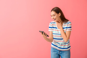 Poster - Laughing young woman with e-reader on color background