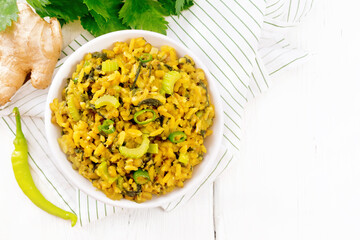 Poster - Kitchari with celery in bowl on light board top