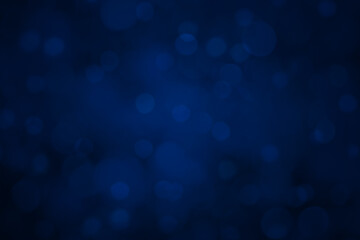 Blue abstract blurred bokeh background usable for Christmas and New Year greetings or holidays template, with copy space available for text.