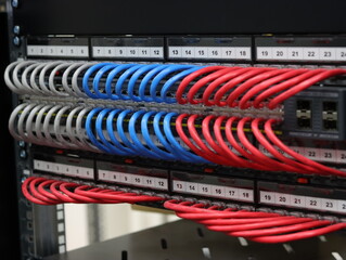 Connecting an Ethernet switch using patch cords with RJ45 connectors for data transmission in the data center.