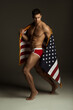 Fitness man in red underwear with american flag