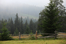 Autumn Meadow With A Old Wooden Fence On A Farm Close Up, In The Smoky Mountains On A Foggy Day. Travel Destination Scenic, Carpathian Mountains