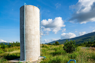 Water cement tank on blue sky background
