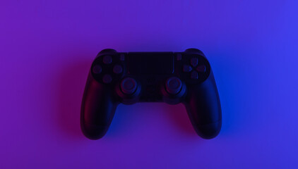 Wall Mural - Gamepad with neon purple blue light. Gaming concept.