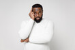 © ViDi Studio - Preoccupied puzzled pensive confused young african american man 20s wearing casual basic sweater standing put hand on head looking camera isolated on white color wall background studio portrait.
