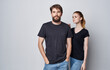young couple in black t-shirts and jeans studio lifestyle elegant style