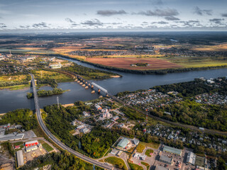 Large deep river. The river is crossed by two bridges. Road and railway bridges.