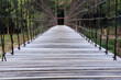 close up wooden foot bridge across river
