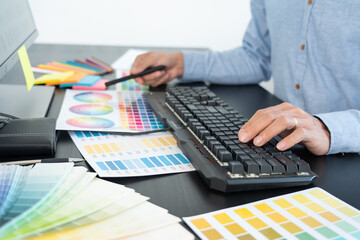 Poster - creative graphic designer choosing color scale for editing artwork while working in office.