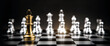 © Eakrin - Close up king chess standing on chess board with silver chess in the back concepts of business team and leadership strategy and organization management.