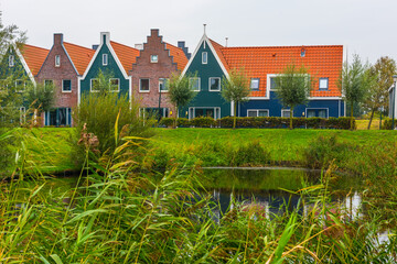 Wall Mural - Volendam is a town in North Holland in the Netherlands. Colored houses of marine park in Volendam.