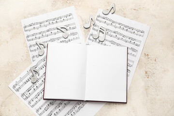 Wall Mural - Blank book with music notes on white background